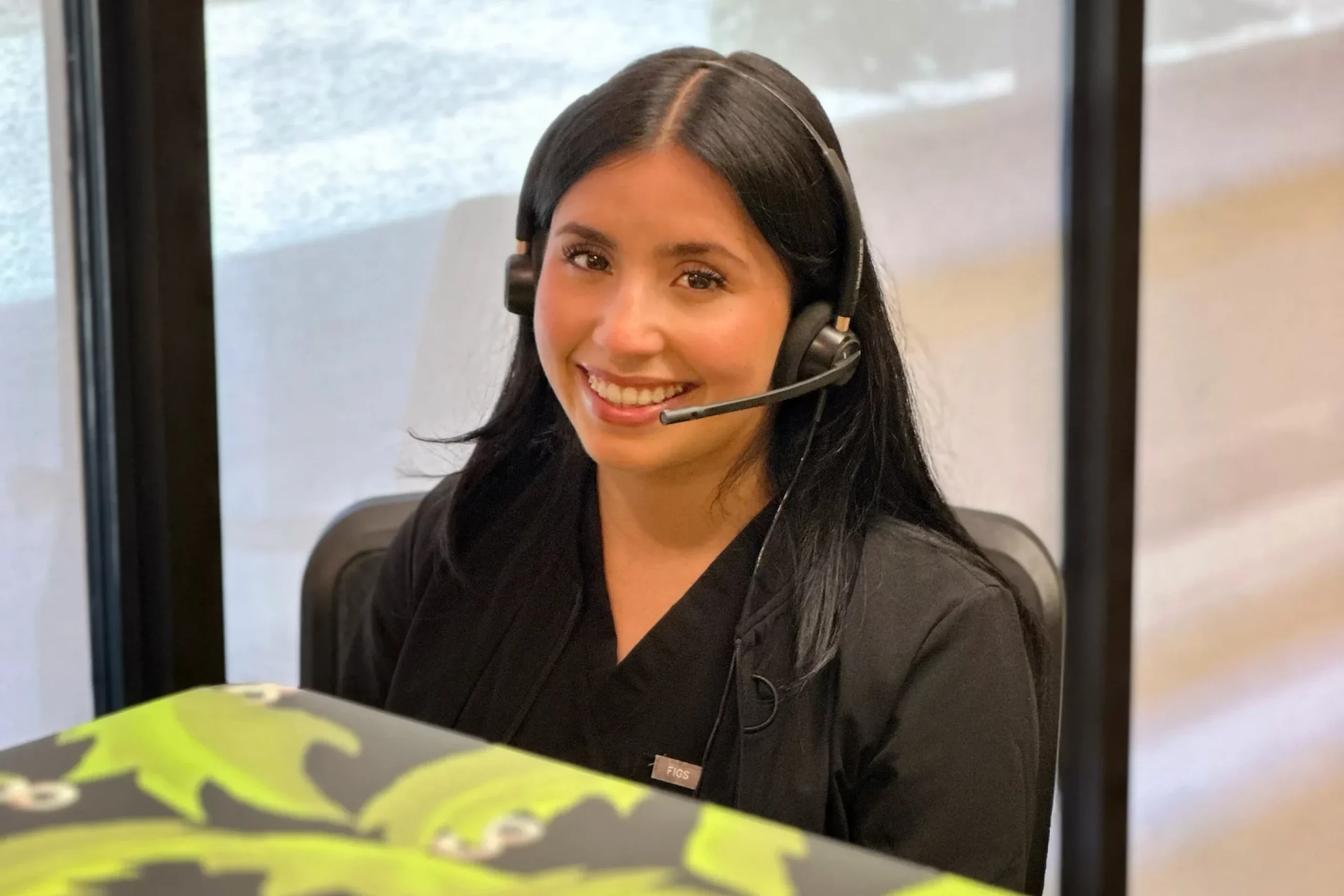 Front desk staff wearing a headset at an emergency dental office